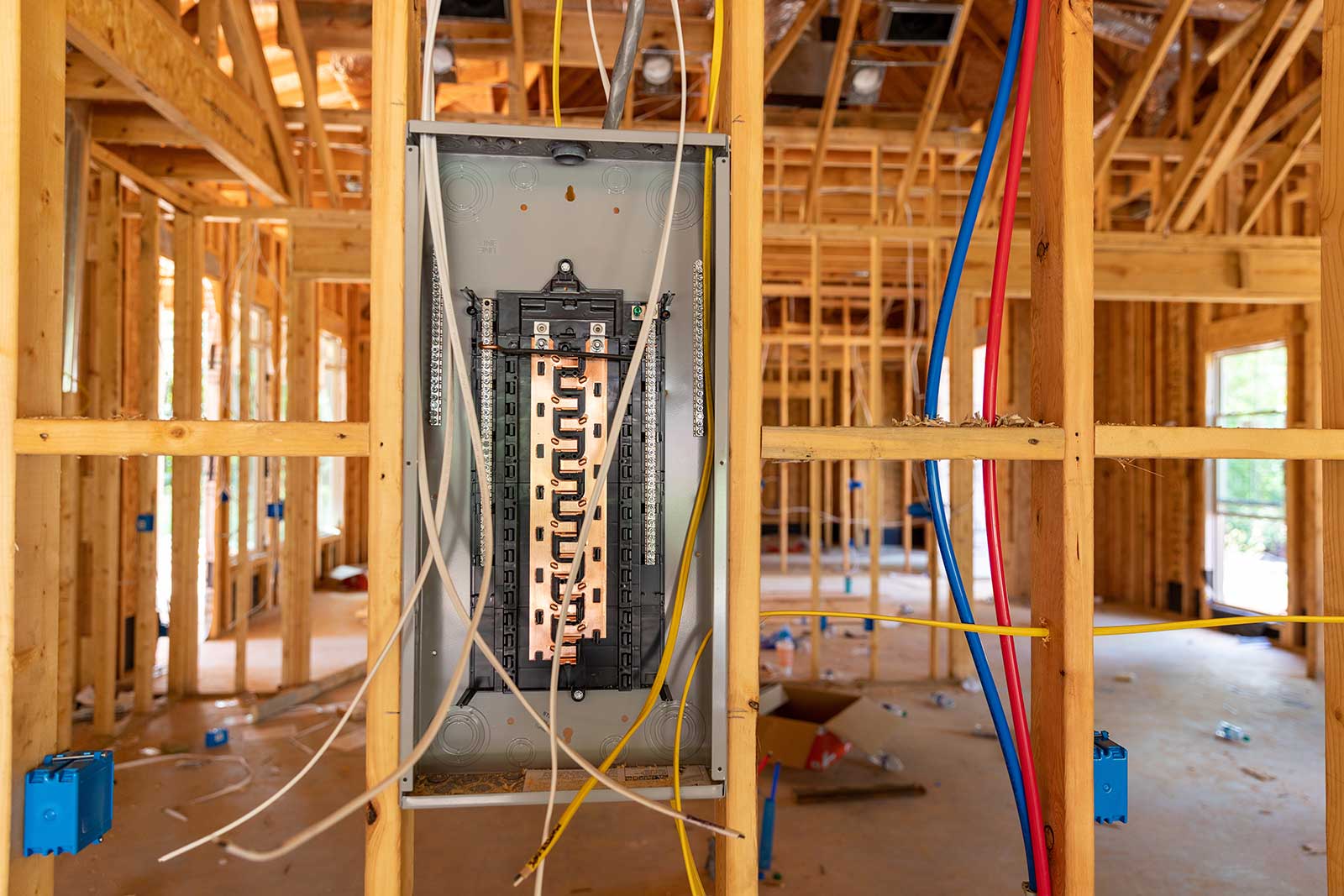 Electrician wiring a new construction home in Portland, ME